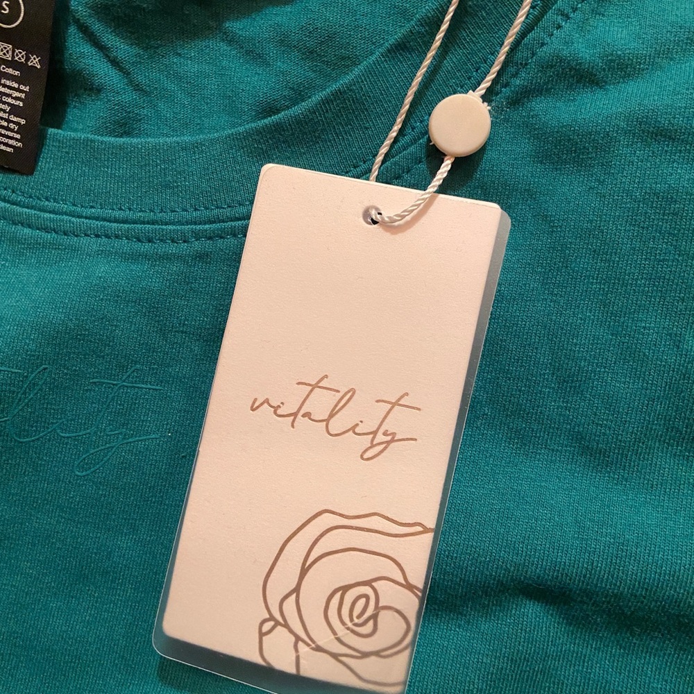 Vitality’s (formerly known as Balance Athletica) teal over-sized crop t-shirt.